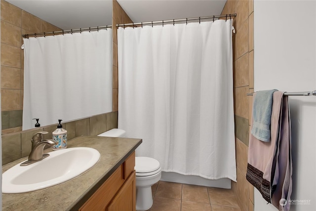 full bathroom with toilet, shower / bath combination with curtain, tile patterned floors, and vanity