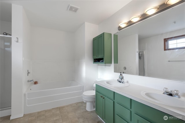 full bathroom featuring toilet, vanity, and independent shower and bath