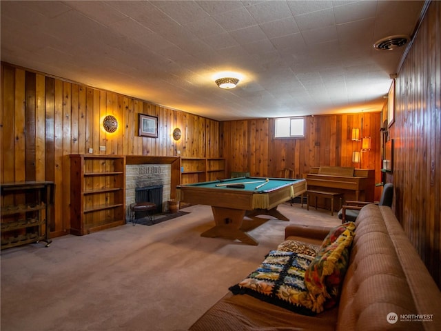 recreation room featuring light colored carpet, pool table, and a fireplace