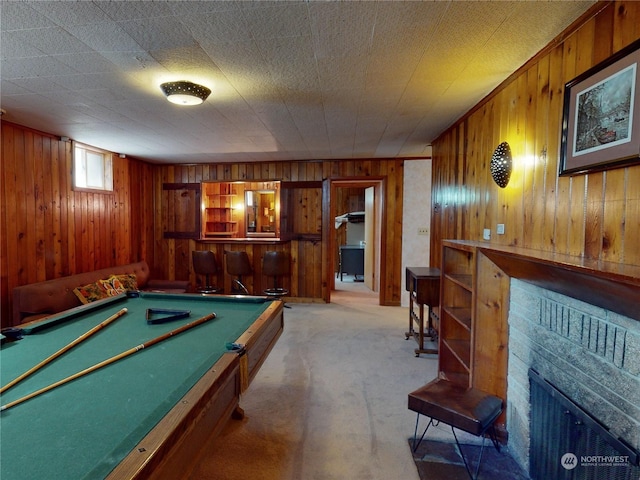 playroom with light carpet, wooden walls, bar, and billiards