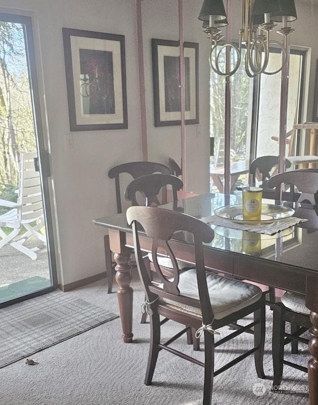 dining space featuring carpet