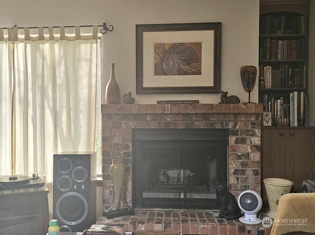 room details featuring a brick fireplace