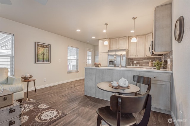 dining area with dark hardwood / wood-style flooring