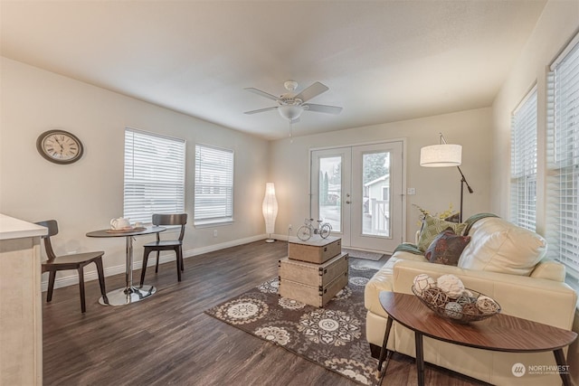 living room with french doors, ceiling fan, and dark hardwood / wood-style flooring