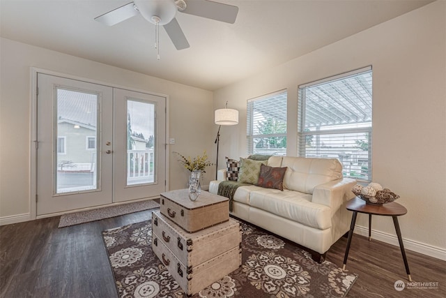 living room with french doors and dark wood-type flooring