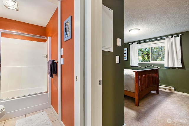 corridor with baseboard heating, a textured ceiling, and light tile patterned floors