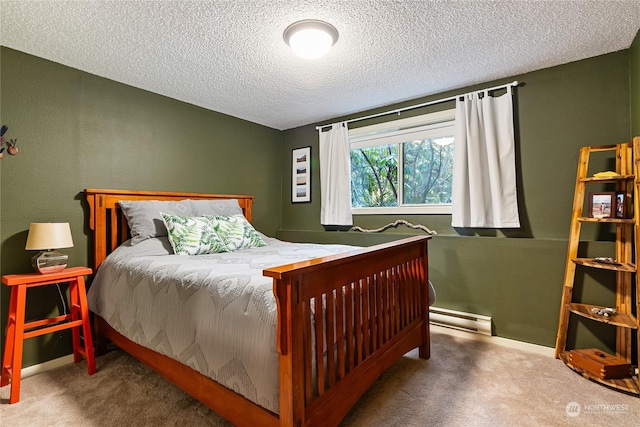 carpeted bedroom with a baseboard radiator and a textured ceiling