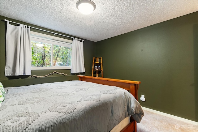 carpeted bedroom with a textured ceiling