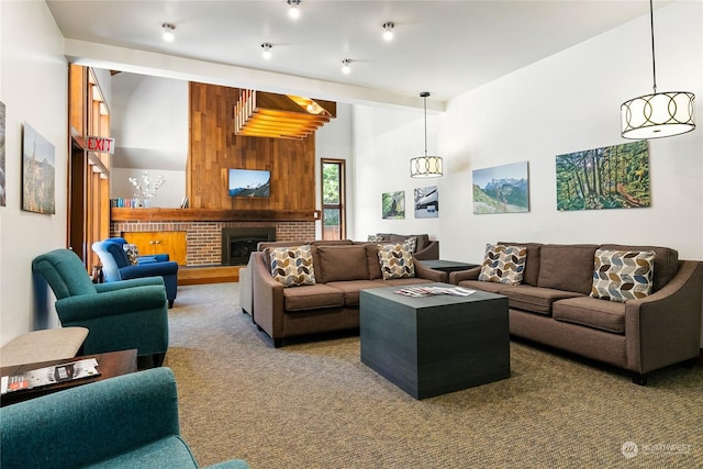 carpeted living room with a brick fireplace and wooden walls