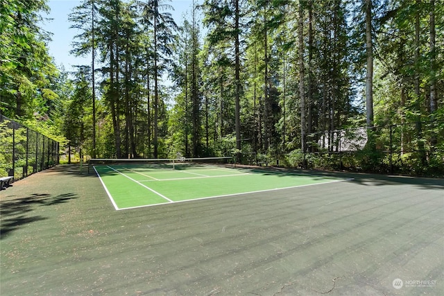 view of sport court with basketball hoop