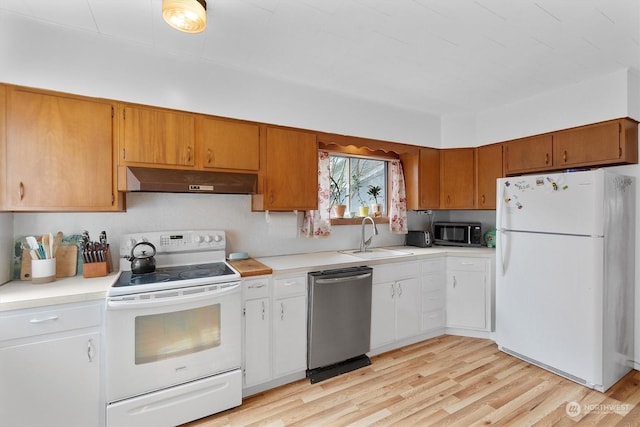 kitchen featuring light hardwood / wood-style floors, sink, and white appliances