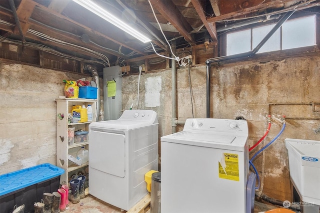 laundry room featuring sink and washer and dryer