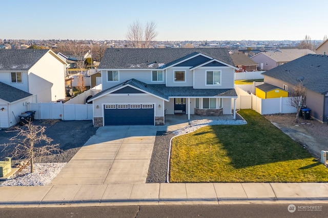 front of property with a garage and a front lawn