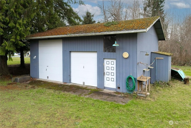 garage with a lawn