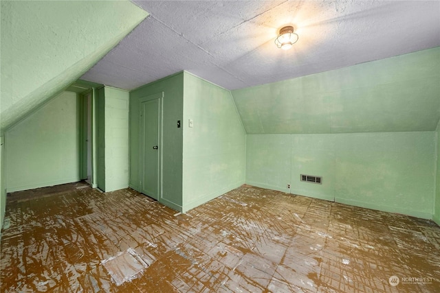 bonus room with vaulted ceiling