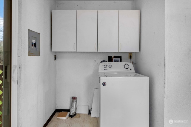 washroom featuring cabinets, electric panel, and washer / clothes dryer