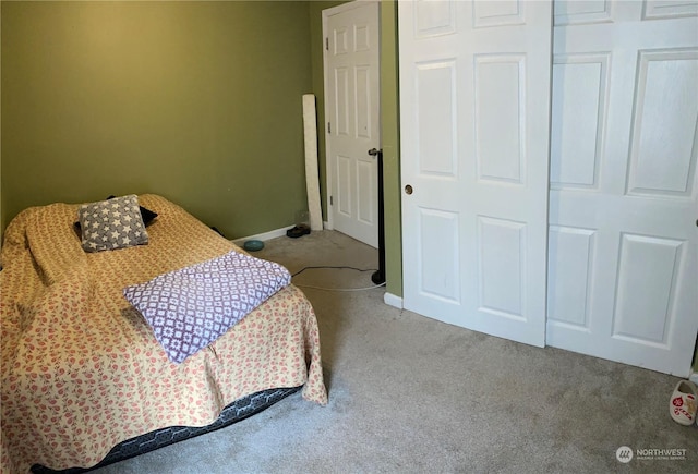 bedroom featuring light carpet