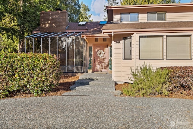 view of front of home featuring a sunroom