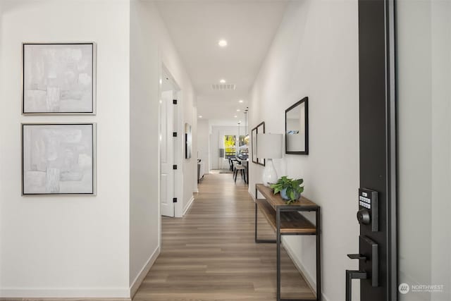 hallway featuring hardwood / wood-style flooring