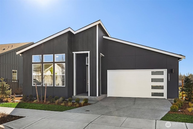 modern home featuring driveway and an attached garage