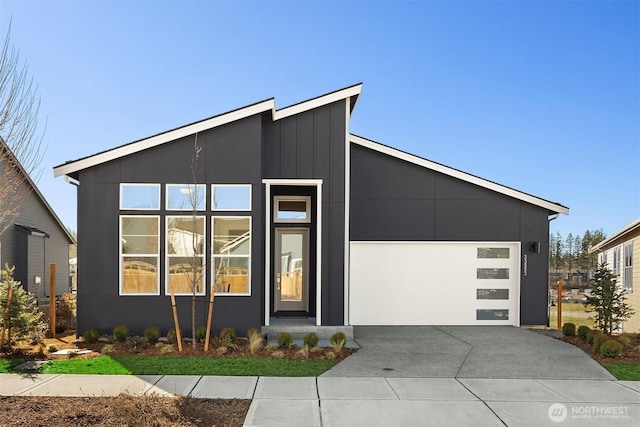 modern home with driveway and a garage