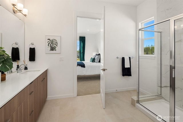 ensuite bathroom featuring ensuite bath, a marble finish shower, vanity, and baseboards