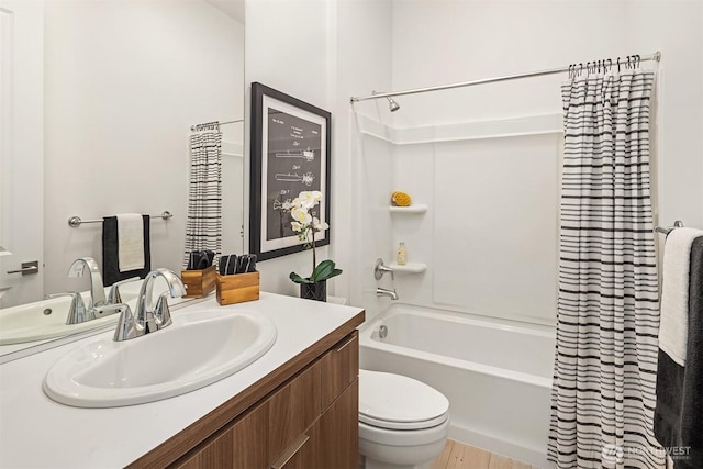 full bath featuring toilet, shower / bath combo, and vanity