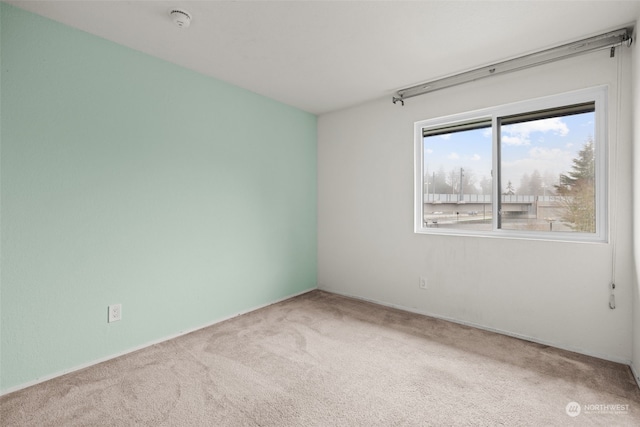 empty room featuring carpet flooring