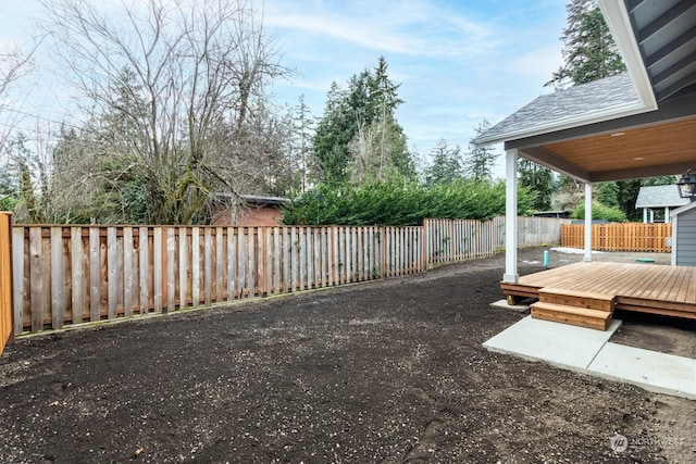 view of yard with a deck