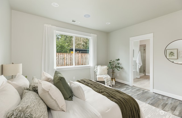 bedroom with light hardwood / wood-style flooring