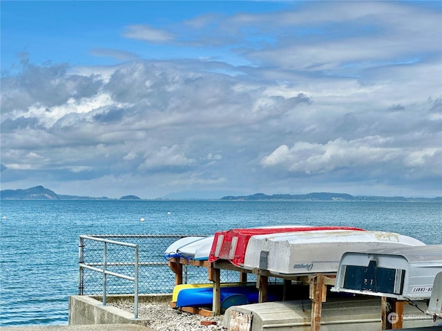 dock area with a water and mountain view