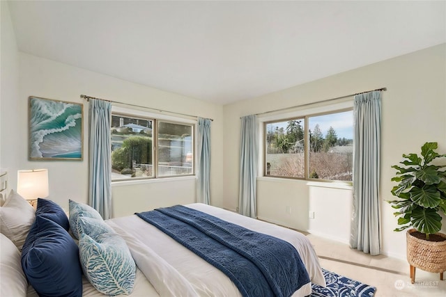 bedroom with light colored carpet