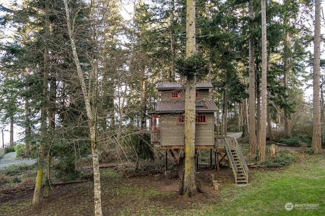 rear view of house with a playground
