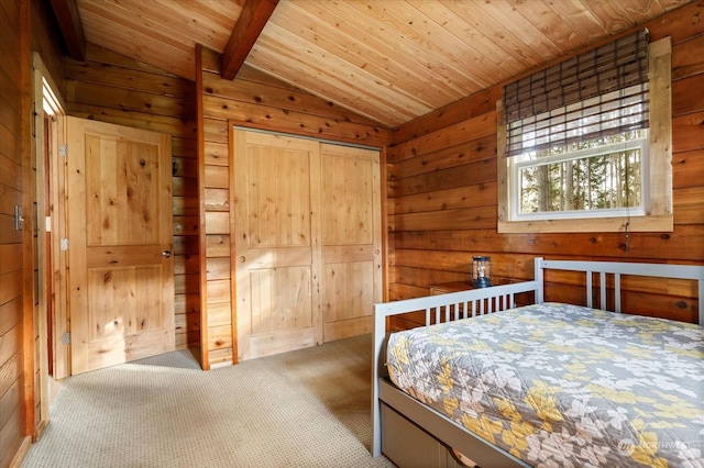 bedroom with wood walls, lofted ceiling with beams, light colored carpet, and wooden ceiling