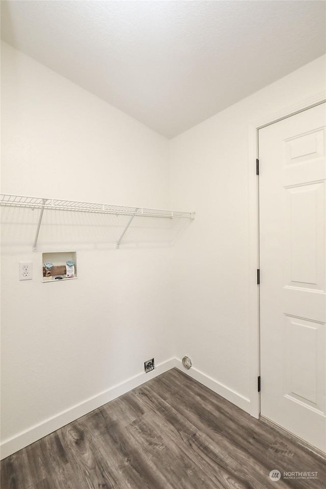 clothes washing area with dark hardwood / wood-style flooring and hookup for a washing machine