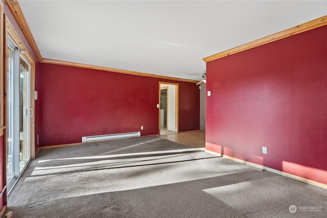 unfurnished room with crown molding, a healthy amount of sunlight, baseboard heating, and carpet flooring