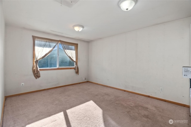 empty room with light colored carpet