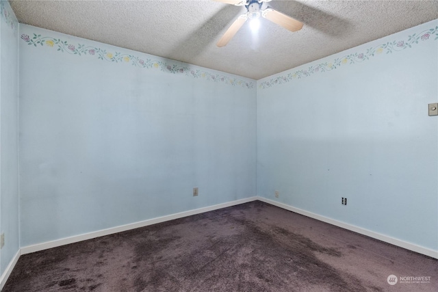 carpeted empty room featuring ceiling fan and a textured ceiling