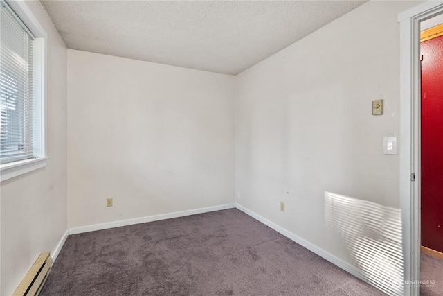 unfurnished room featuring a baseboard radiator, a textured ceiling, and dark colored carpet