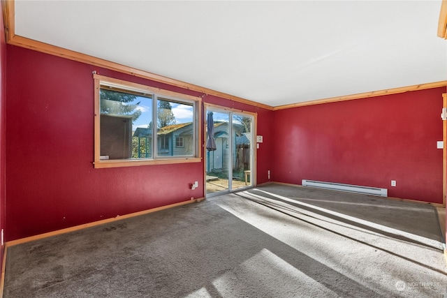 spare room with a baseboard radiator, ornamental molding, and carpet