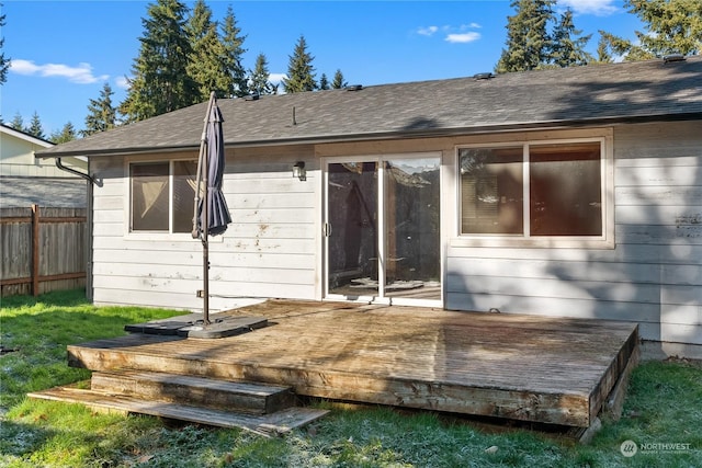 back of house featuring a wooden deck