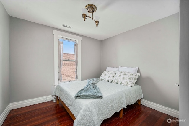 bedroom featuring dark hardwood / wood-style flooring