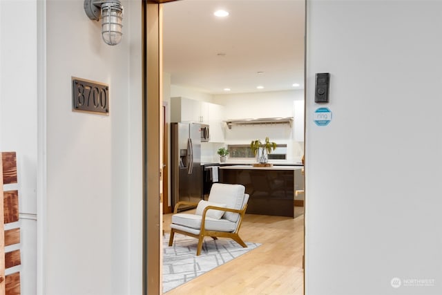 hallway with light hardwood / wood-style flooring