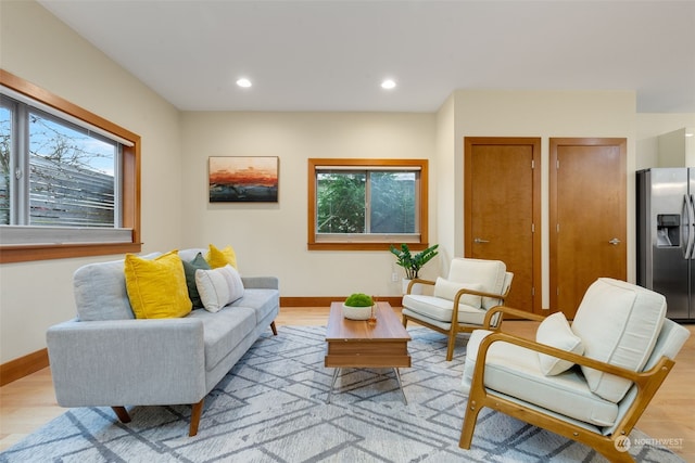 sitting room with a healthy amount of sunlight and light wood-type flooring