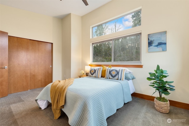 carpeted bedroom with a closet and ceiling fan