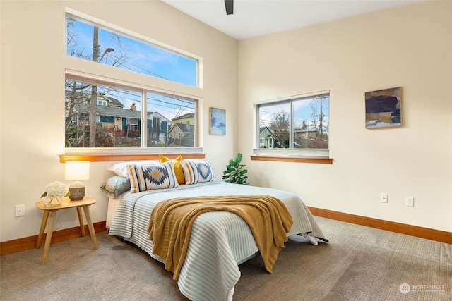 carpeted bedroom with ceiling fan