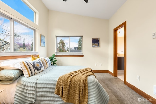 carpeted bedroom featuring ceiling fan and connected bathroom