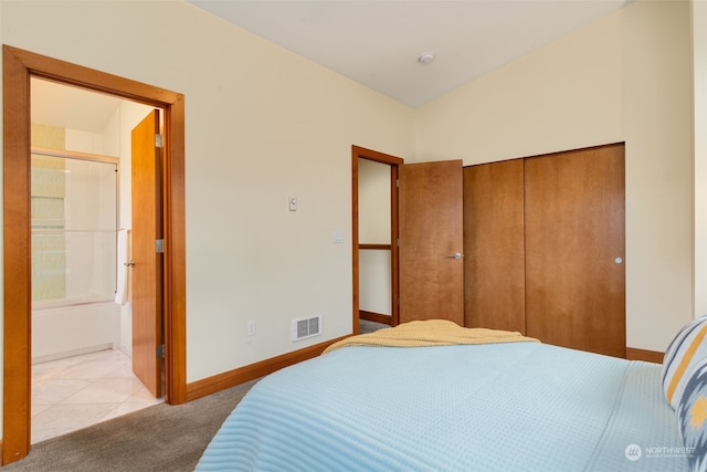 tiled bedroom featuring a closet