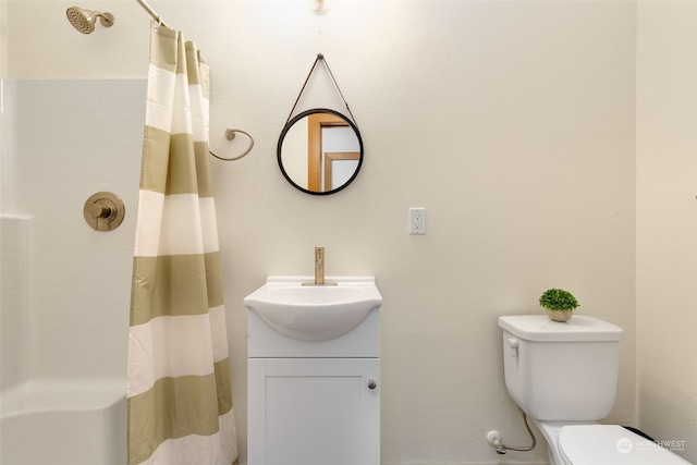 bathroom featuring vanity, toilet, and walk in shower