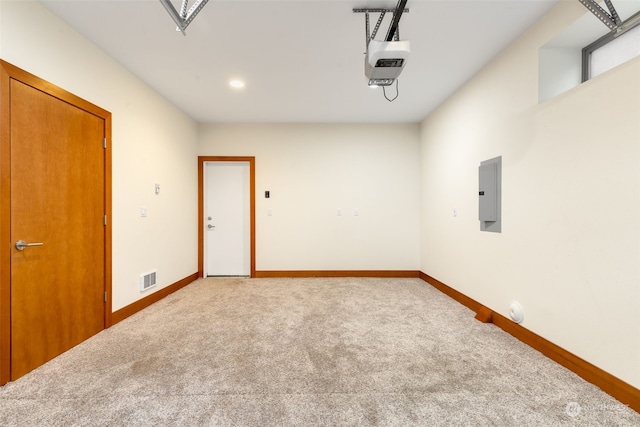 empty room featuring electric panel and carpet floors